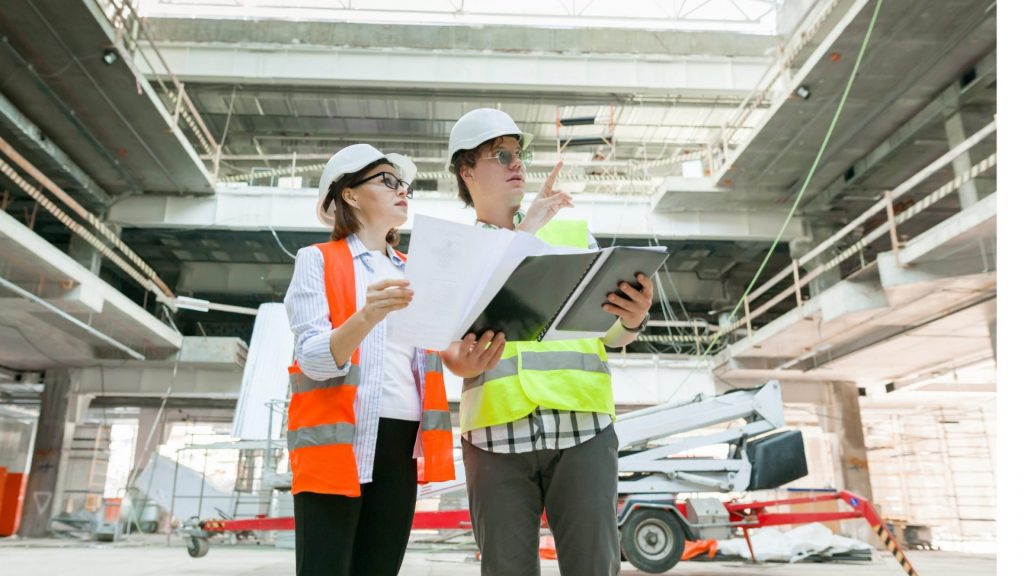 Man and girl with glasses on workfloor